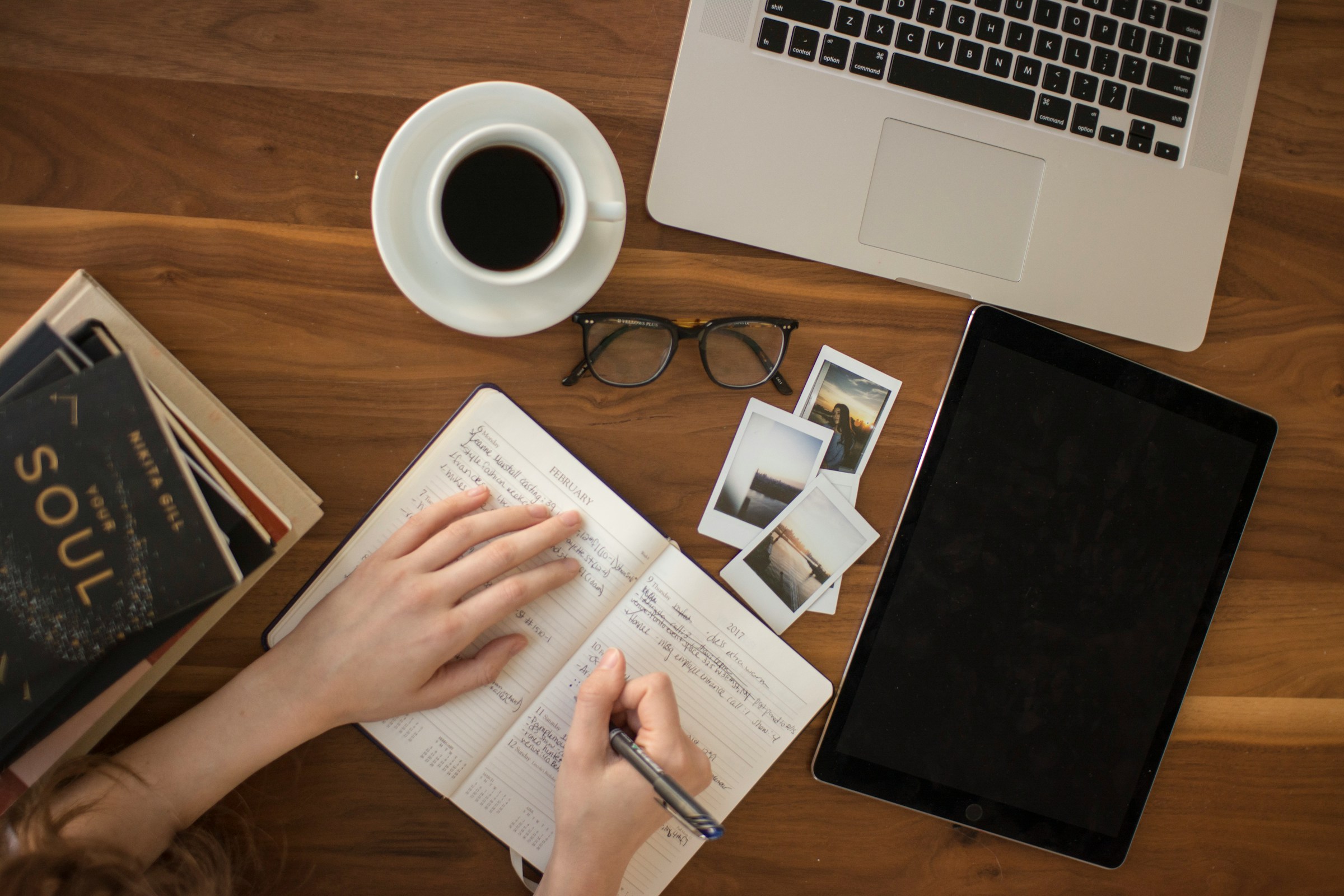 Person learning at desk with educational materials